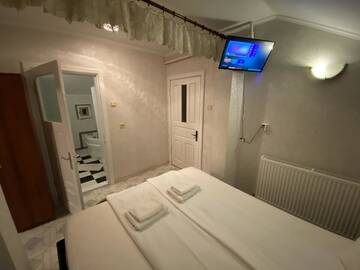 Фото Проживание в семье Apartament Mansarda г. Куртя-де-Арджеш 1